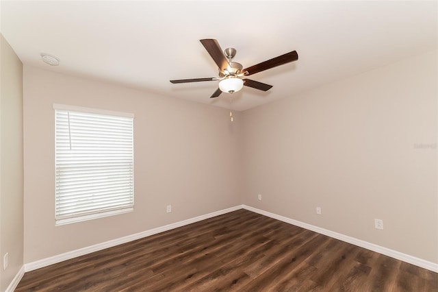 unfurnished room featuring ceiling fan and dark hardwood / wood-style flooring