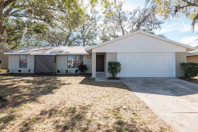 ranch-style house featuring a garage