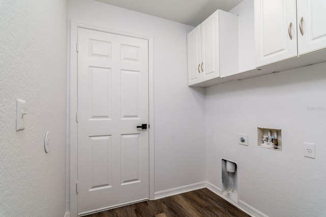 washroom featuring dark hardwood / wood-style floors, cabinets, hookup for an electric dryer, and hookup for a washing machine