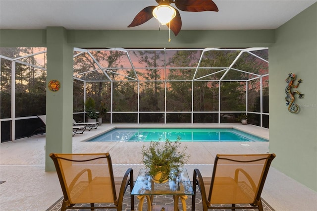 view of pool featuring a patio and glass enclosure