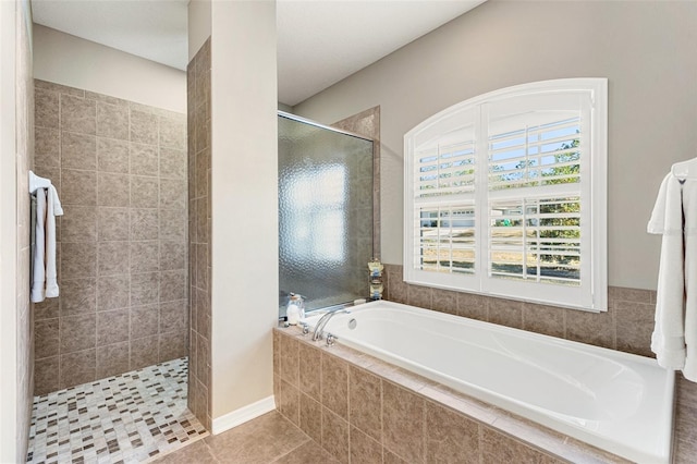 bathroom featuring separate shower and tub and tile patterned floors