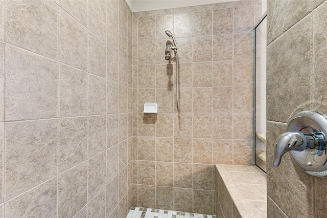 bathroom featuring tiled shower