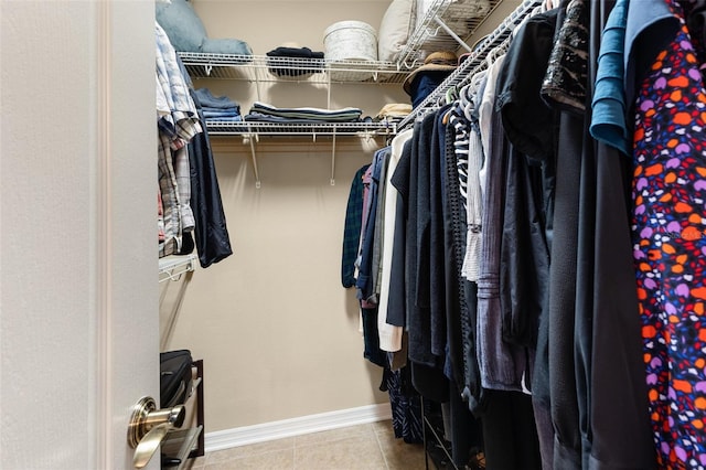 spacious closet featuring light tile patterned flooring