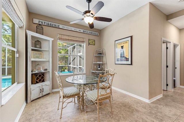 dining space featuring ceiling fan