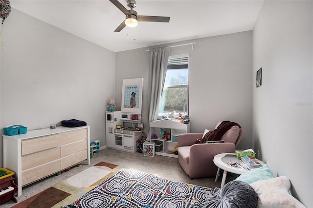 sitting room with carpet floors and ceiling fan