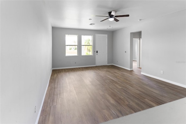 empty room featuring dark hardwood / wood-style floors and ceiling fan