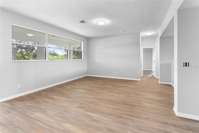 empty room with light hardwood / wood-style floors