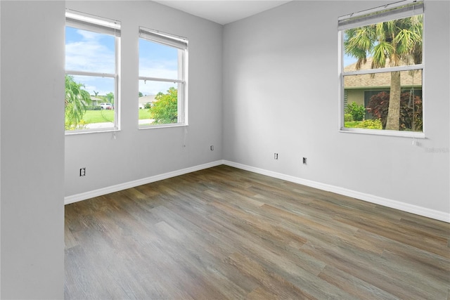 unfurnished room featuring dark hardwood / wood-style flooring