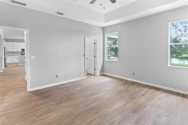 unfurnished room featuring ceiling fan and light hardwood / wood-style flooring