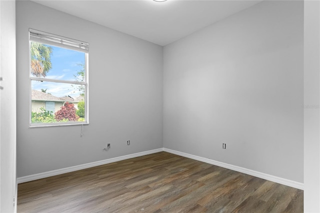 empty room featuring dark wood-type flooring