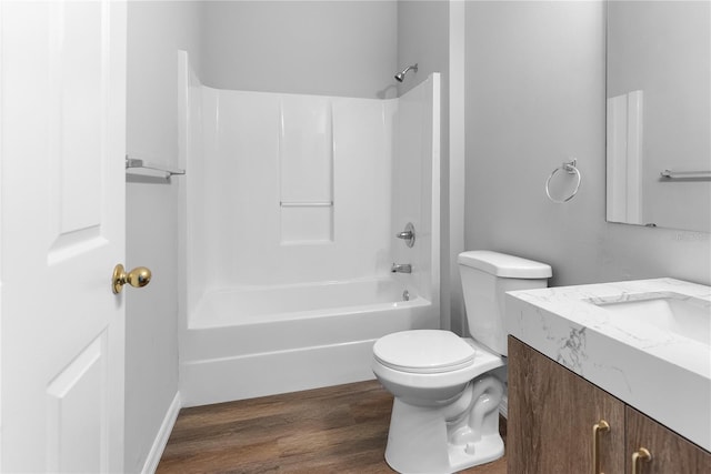 full bathroom with shower / bathtub combination, vanity, toilet, and wood-type flooring