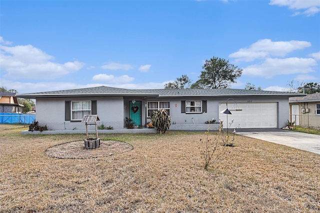 ranch-style home with a garage and a front yard