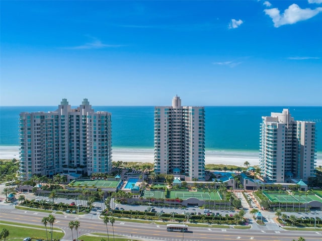 aerial view with a water view and a view of the beach