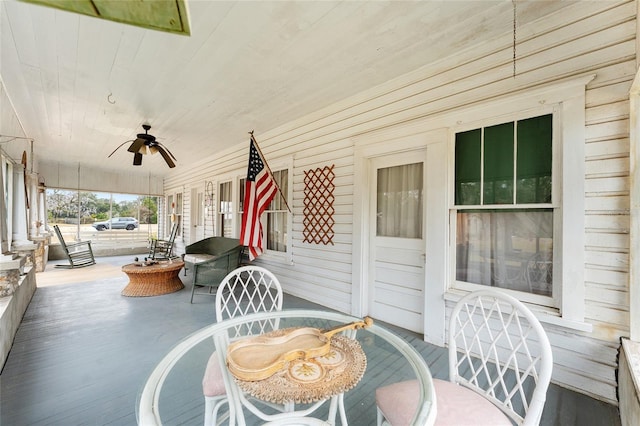 view of patio / terrace with ceiling fan and a porch