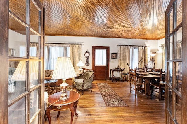 living area with wood ceiling, ornamental molding, hardwood / wood-style floors, and a wealth of natural light