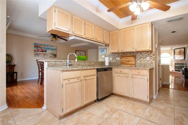 kitchen with dishwasher, backsplash, ornamental molding, light brown cabinetry, and kitchen peninsula