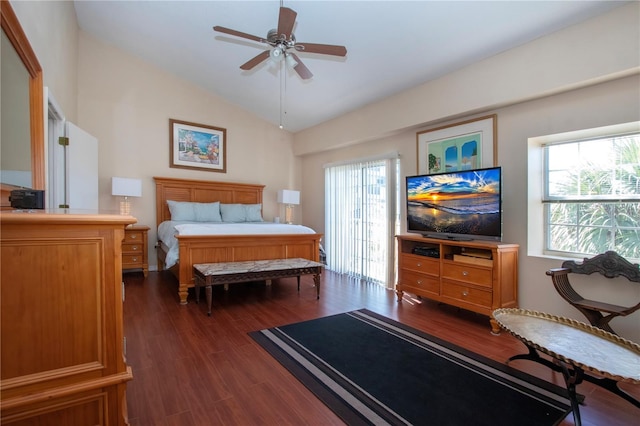 bedroom with ceiling fan, dark hardwood / wood-style floors, and vaulted ceiling