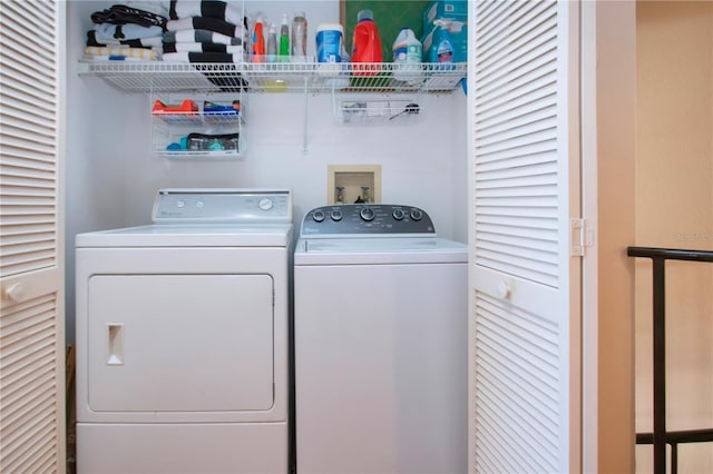 laundry room with separate washer and dryer