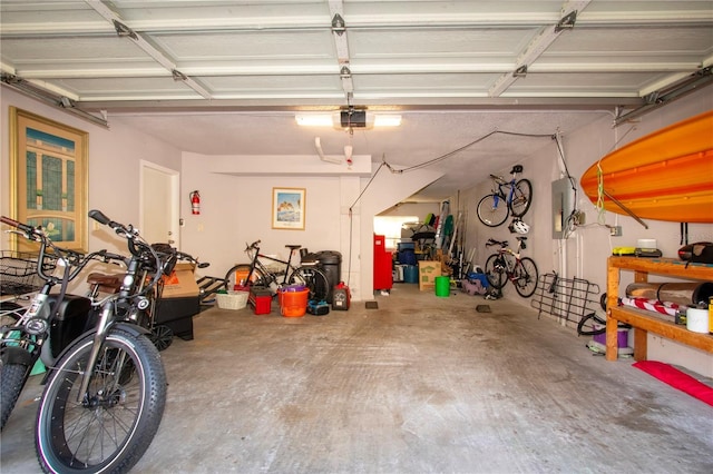 garage featuring a garage door opener and electric panel