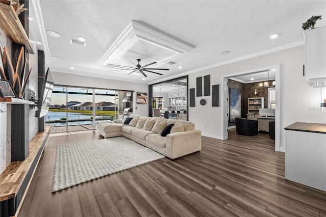 living room with dark hardwood / wood-style flooring, a textured ceiling, ornamental molding, and ceiling fan