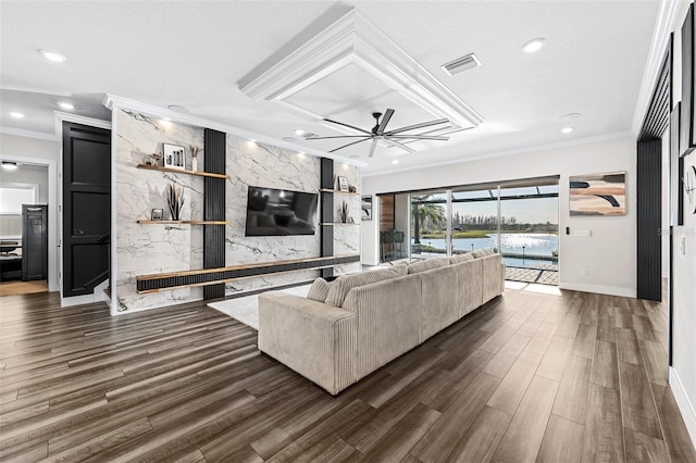 living room featuring ceiling fan, ornamental molding, and dark hardwood / wood-style floors