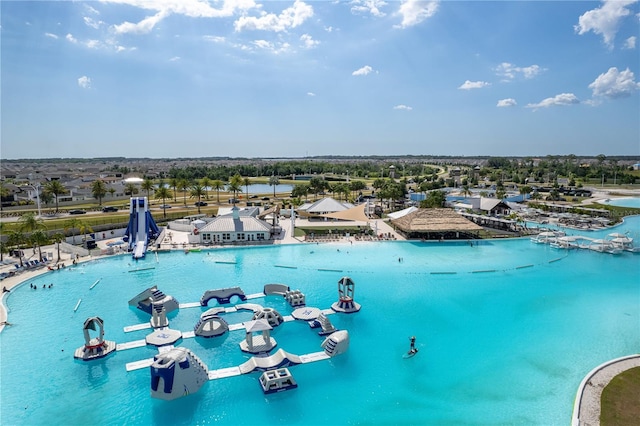 birds eye view of property with a water view