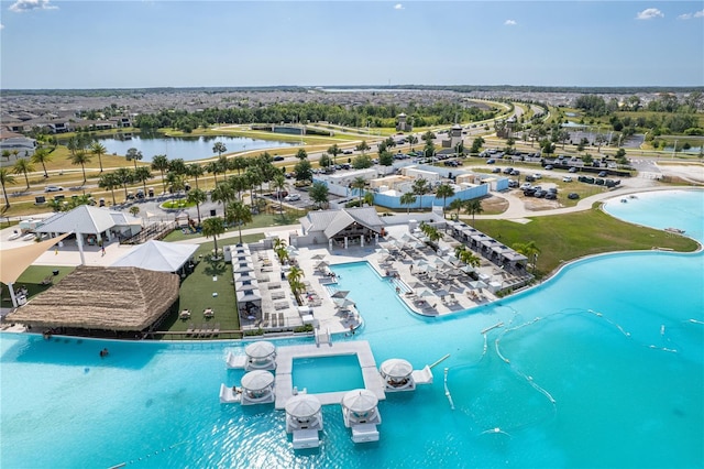 birds eye view of property with a water view