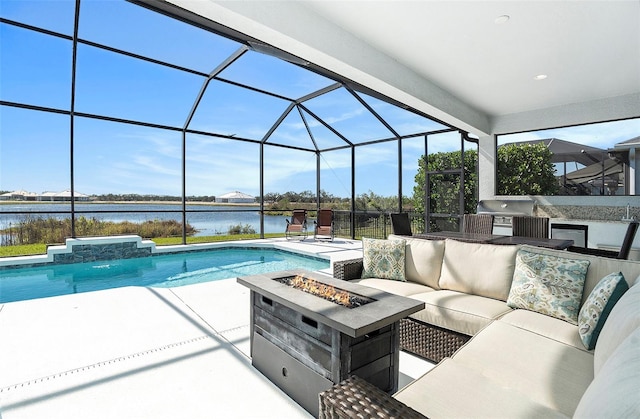 view of swimming pool featuring a water view, area for grilling, pool water feature, and a lanai