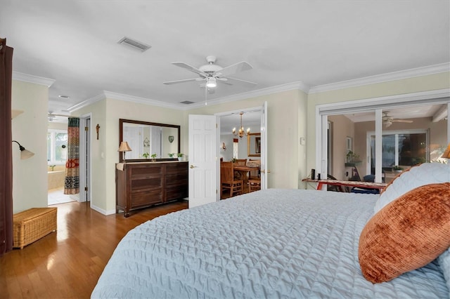 bedroom with hardwood / wood-style flooring, ornamental molding, and ceiling fan with notable chandelier