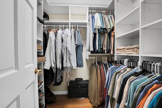 walk in closet featuring hardwood / wood-style floors