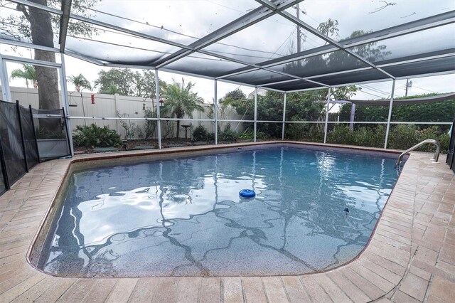 view of pool with a lanai