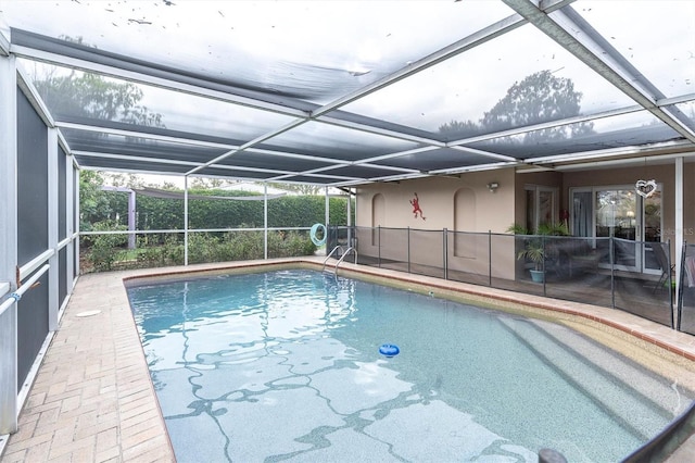 view of pool featuring a lanai