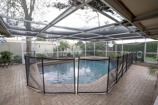 view of pool featuring a lanai, a patio area, and a jacuzzi