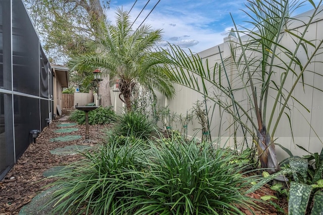 view of yard with a lanai