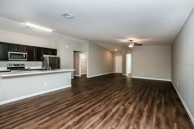 kitchen featuring sink, dark wood-type flooring, stainless steel appliances, and ceiling fan