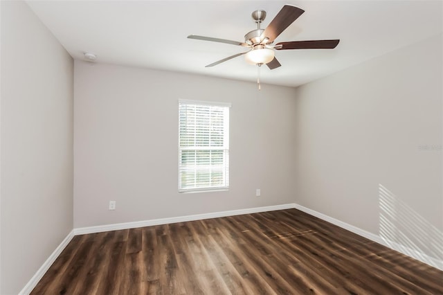 unfurnished room with dark hardwood / wood-style floors and ceiling fan