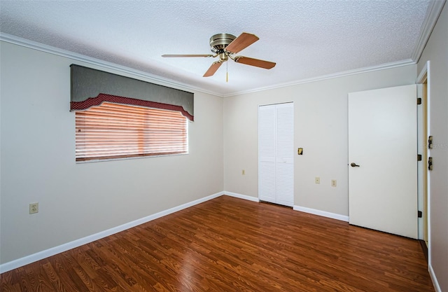 unfurnished bedroom with crown molding, a closet, dark hardwood / wood-style flooring, and a textured ceiling