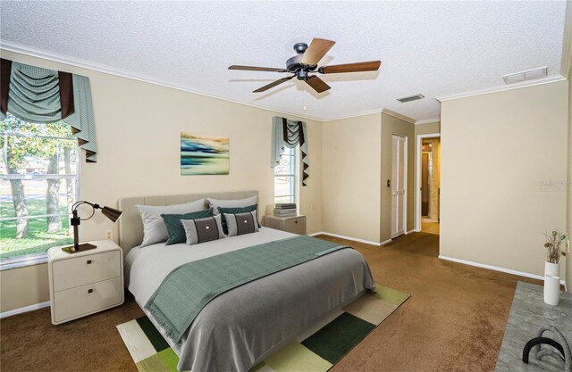 bedroom with crown molding, ceiling fan, a textured ceiling, and dark carpet