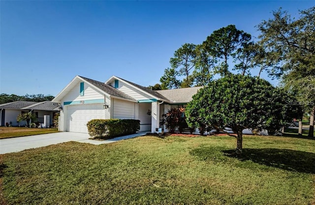 view of front of house with a garage and a front yard