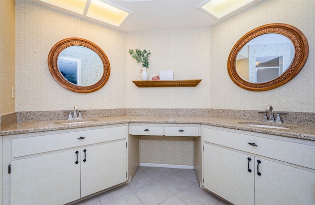 bathroom with vanity and tile patterned flooring