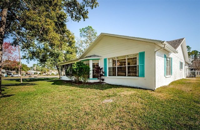 rear view of property with a yard