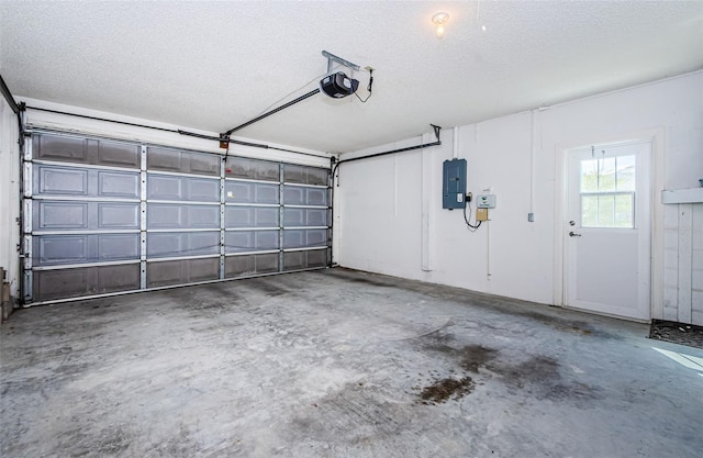 garage featuring a garage door opener and electric panel