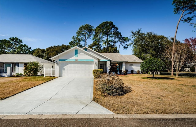 ranch-style home featuring a garage and a front lawn