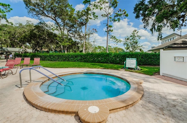 view of pool featuring a patio area and a lawn