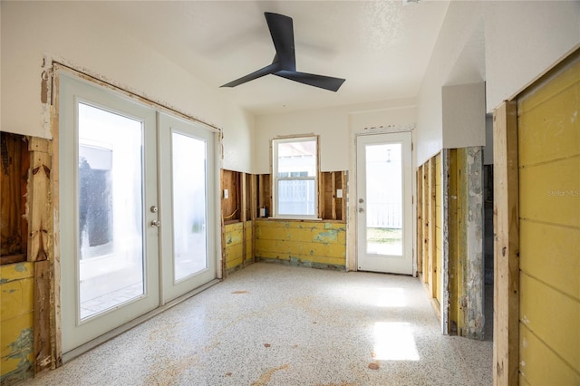 interior space featuring ceiling fan and french doors