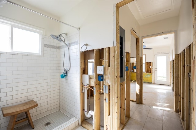 bathroom featuring a tile shower