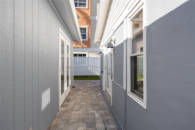 view of side of property with a patio area