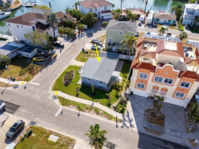 birds eye view of property with a water view