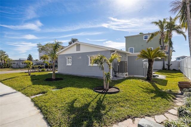 view of side of home with a lawn