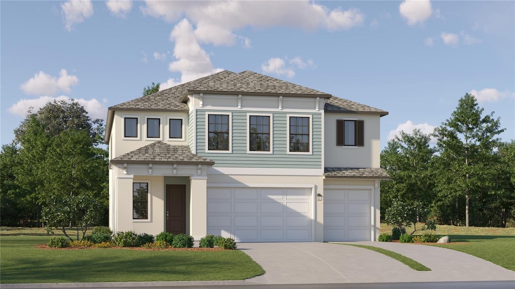 view of front facade with a garage and a front yard